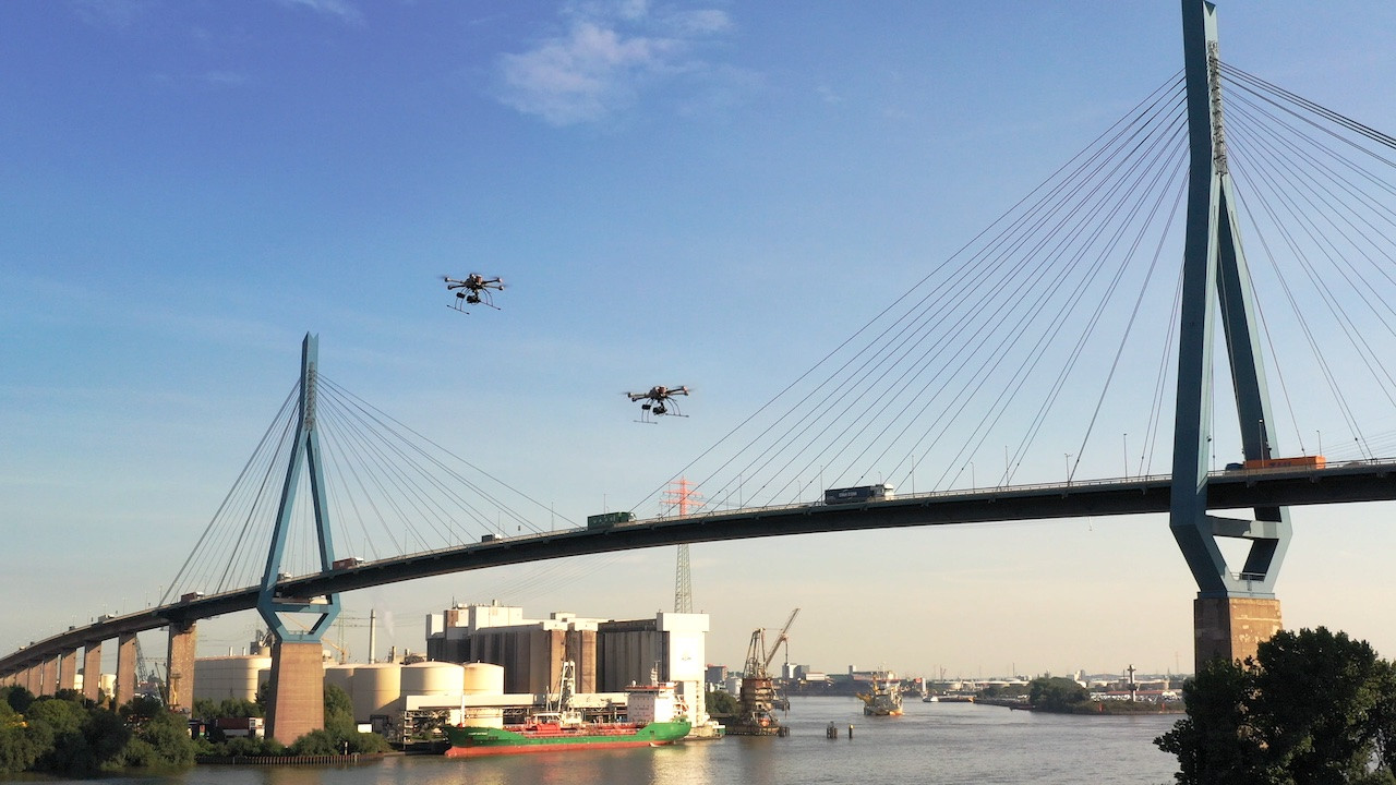 Two HHLA Sky drones near car bridge at the Port of Hamburg